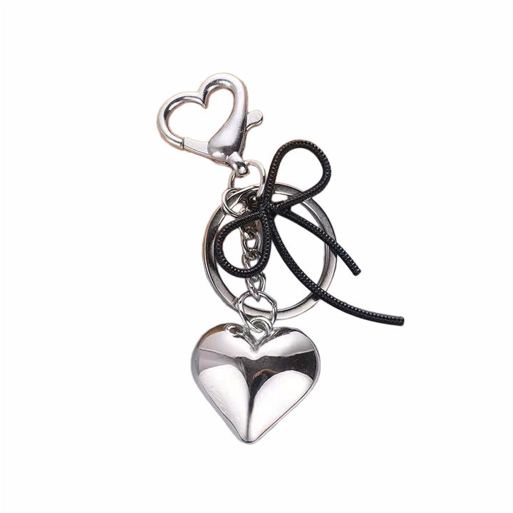 Heart-Shaped Metallic Keychain with Decorative Bow Kalsten
