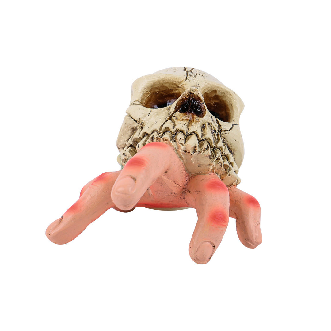 Detailed Halloween decoration sculpture skull with grasping hand