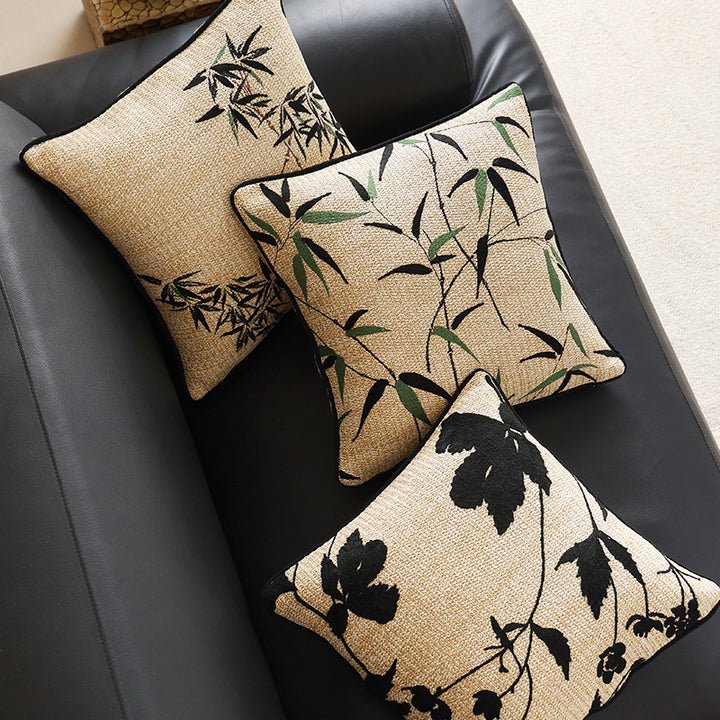 Square decorative pillow with embroidered bamboo design and natural linen texture