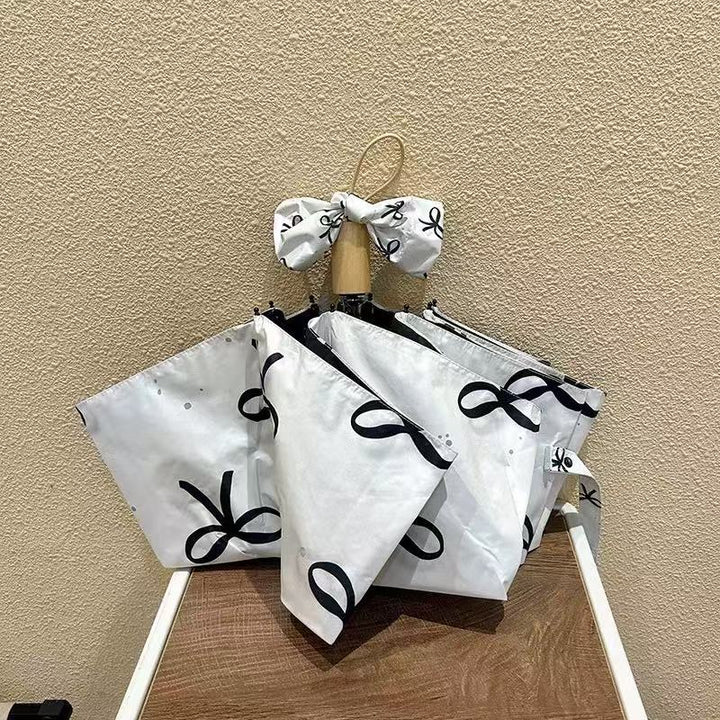 Women's foldable umbrella with elegant bow design Kalsten