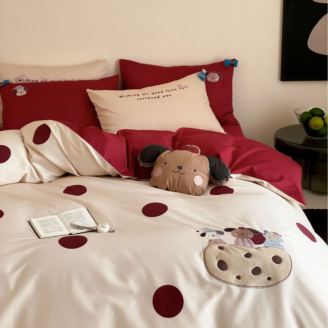 Children's bedding set with embroidered car applique and pompom detail