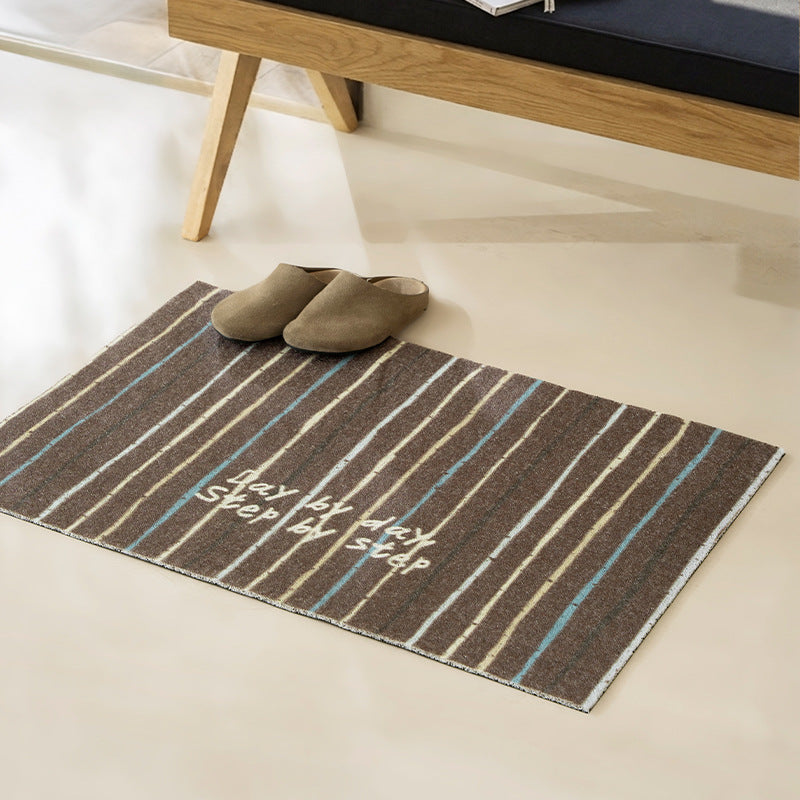Woven door mat with welcome inscription, striped pattern and non-slip back