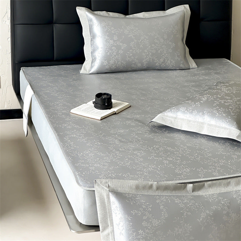 Finely woven satin fitted sheet with floral jacquard relief and reinforced all-round elastic