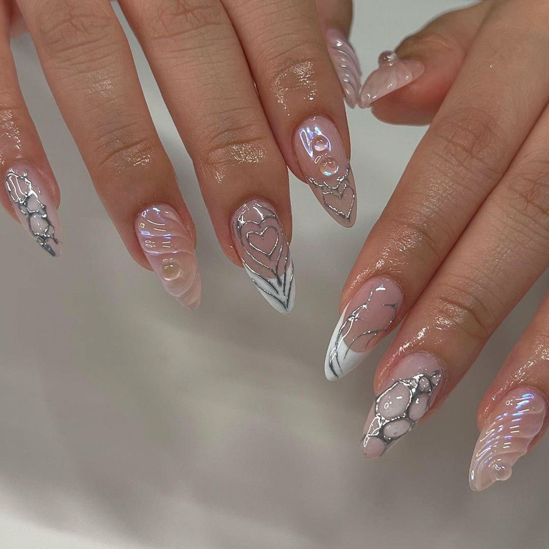 Elegant Stiletto Nail Extensions with Decorative Silver Accents Kalsten