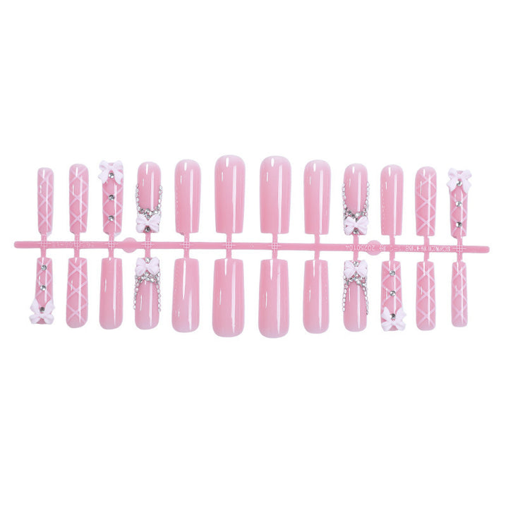 Acrylic nail set with elegant bow and glitter accents Kalsten
