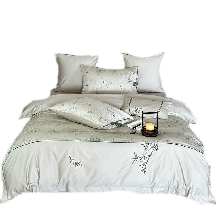 Reversible cotton satin bedding set with fine bamboo print and pillowcases with tie bands