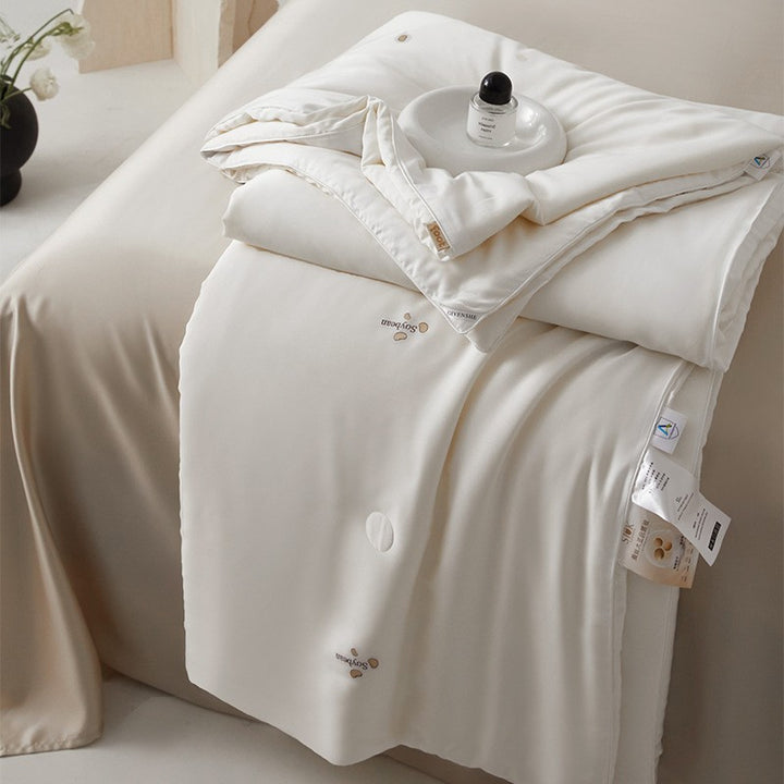 Silk bed cover made of microfiber with subtle embroidery and ultra-light fall