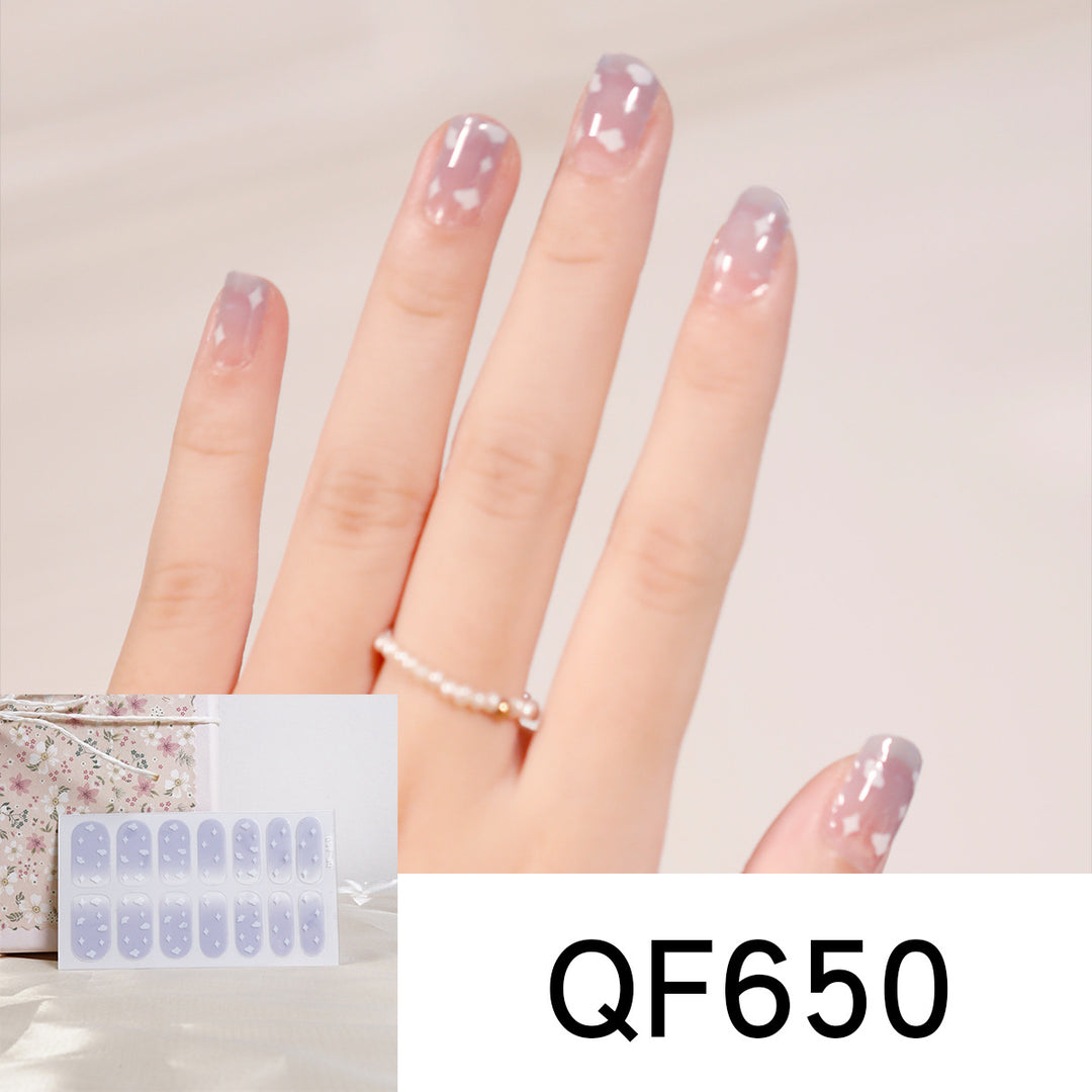 Artificial nail art with heart-shaped designs and soft color gradients Kalsten