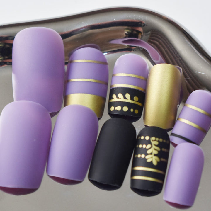 Trendy Press-On Nail Art with Decorative Gold Accents Kalsten