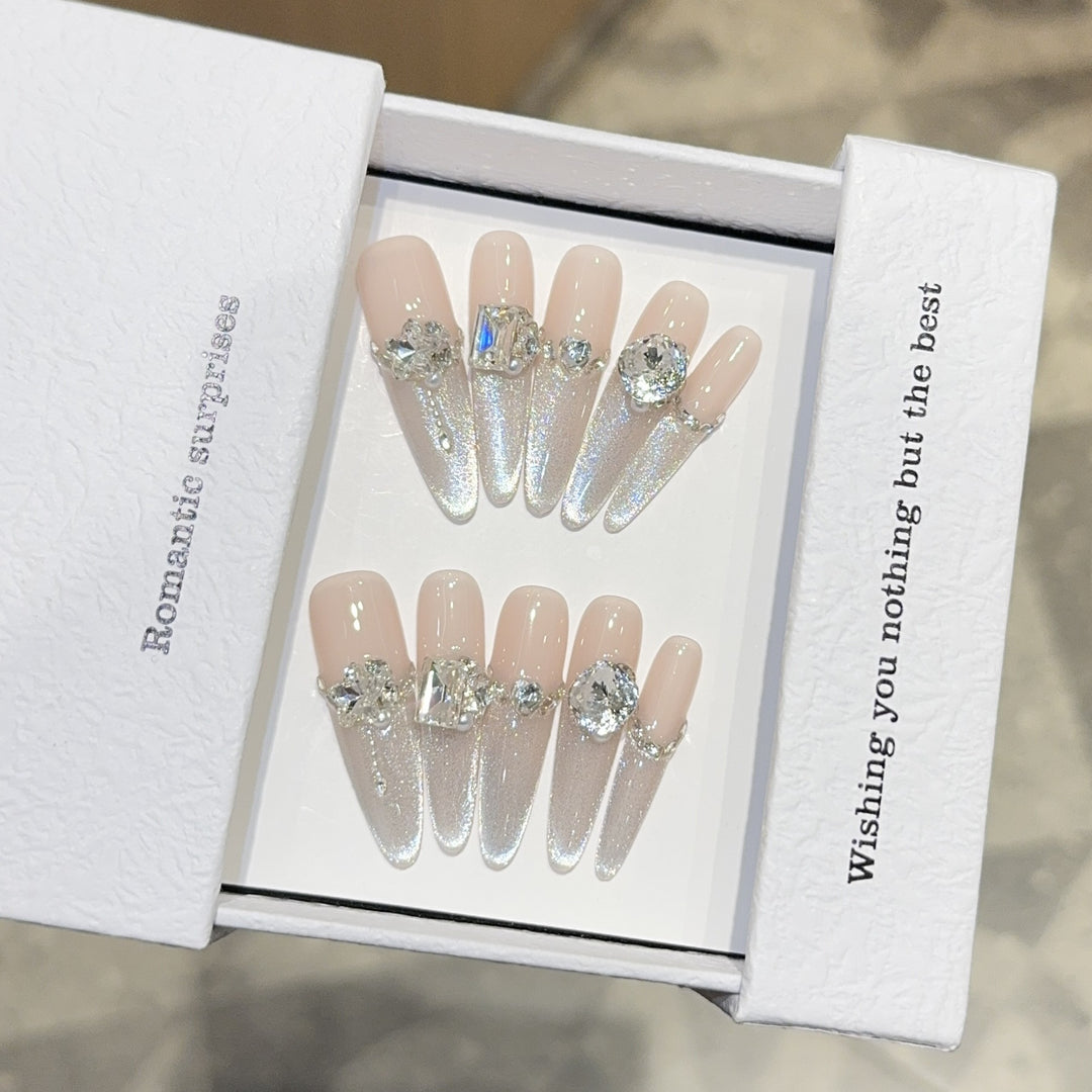 Glamorous artificial nails with sparkling rhinestone embellishments Kalsten
