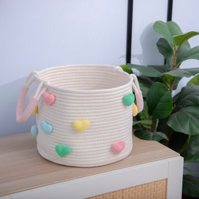 Playful storage basket with heart pattern