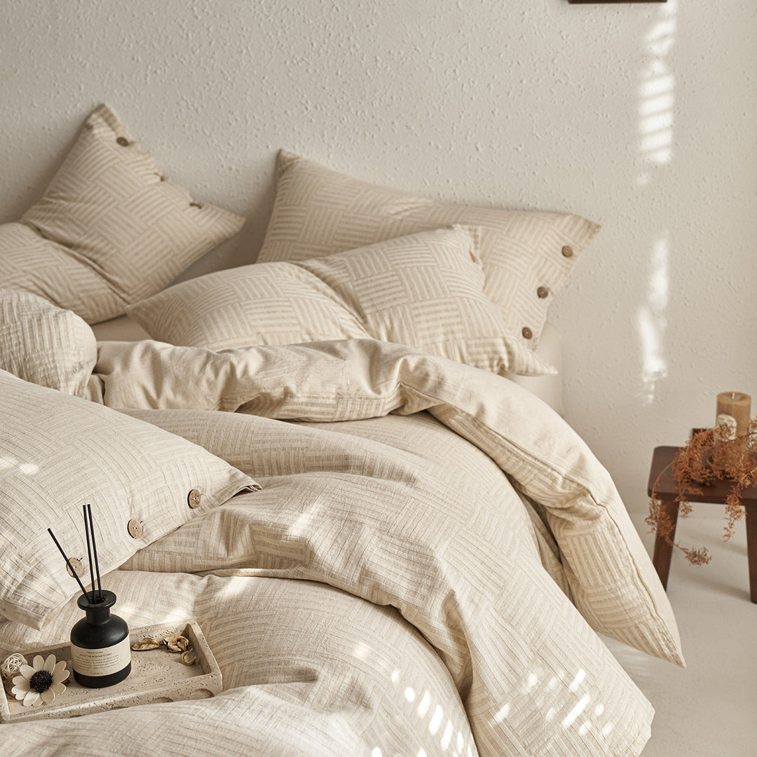 Reversible cotton bedding set with button closure and subtle geometric jacquard
