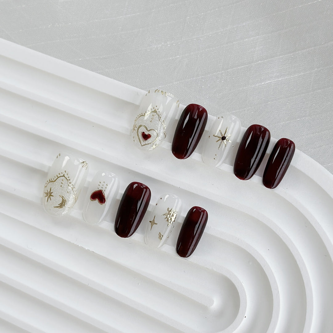 Artistic Press-On Nail Art Set with Heart and Celestial Designs