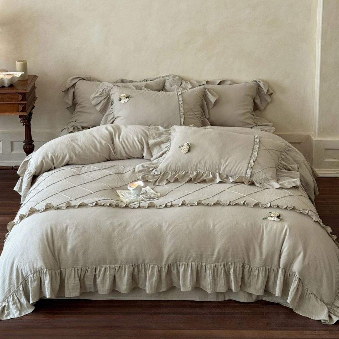 Country house style bedding set with quilted center piece, ruffle and rose appliqué