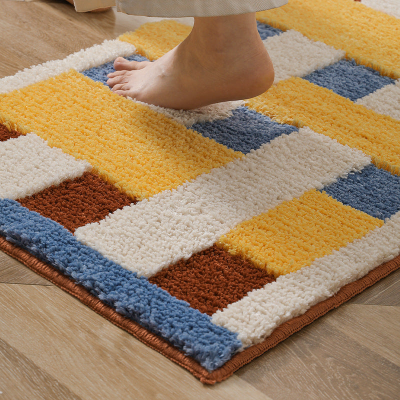 Rectangular tufted door mat with geometric block pattern and non-slip backing Kalsten