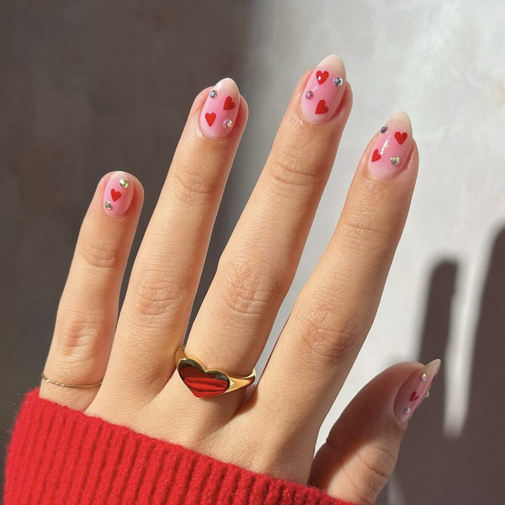 Artful nail art with heart motifs and glamorous details Kalsten
