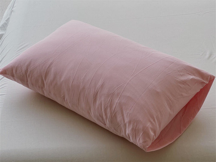 Comfort pillow with breathable cover and shape-retaining filling