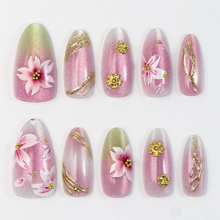 Artificial nails with floral design and gold accents Kalsten