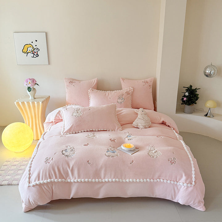 Cute cotton bedding set with embroidered bunny appliqués and pom-pom trim