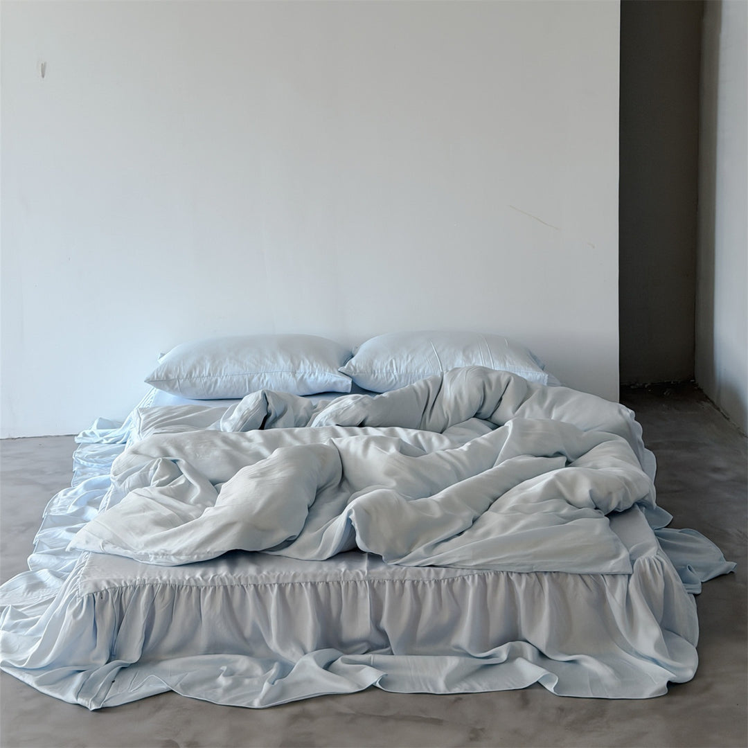 Bedding set with voluminous bed skirt and soft satin finish