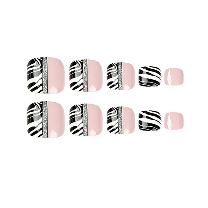 Artistic toenail art with zebra pattern and glitter accents Kalsten