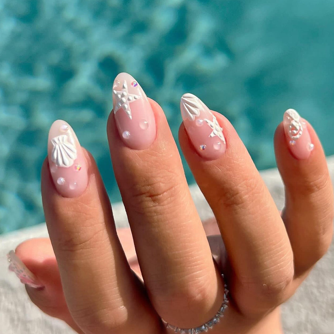Artistic nail designs with shell and star motif Kalsten