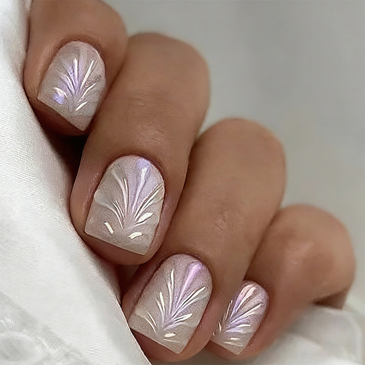 Acrylic nail set with elegant pearl details and fine floral patterns Kalsten