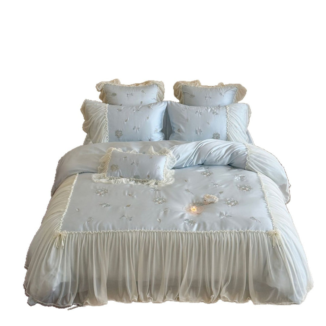 Romantic embroidered bedding set with ruffled frill and tulle overlay