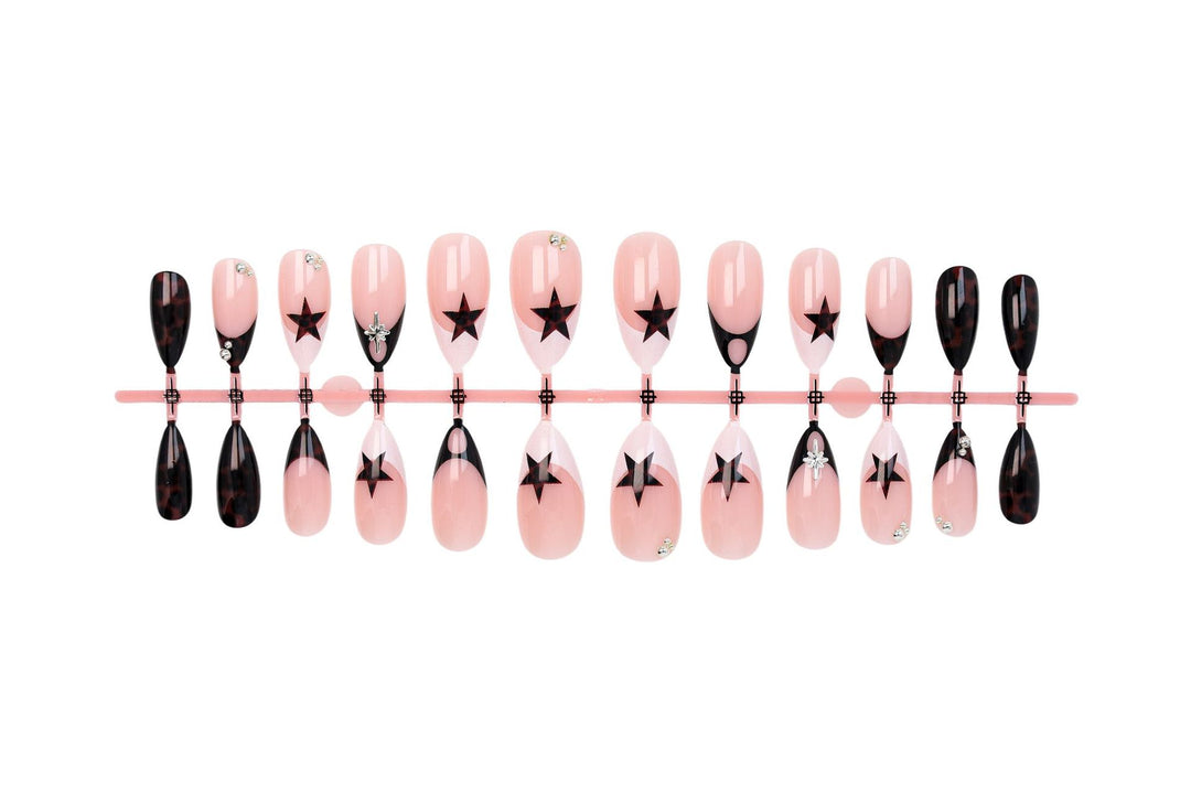 Acrylic nail set with creative star patterns and glitter accents Kalsten