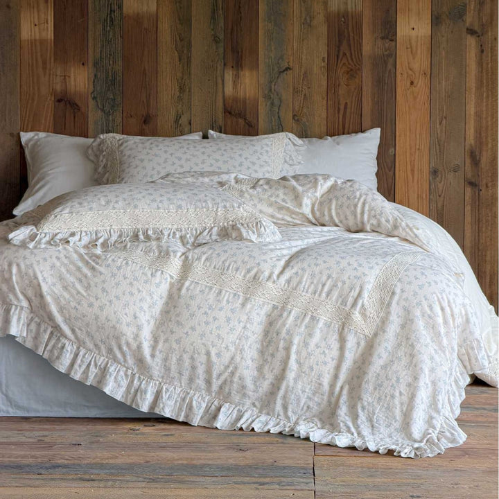 Vintage-inspired bedding set with lace appliqué and ruffle