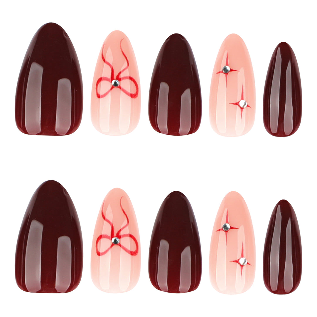 Artful nail art with elegant bows and rhinestone embellishments Kalsten