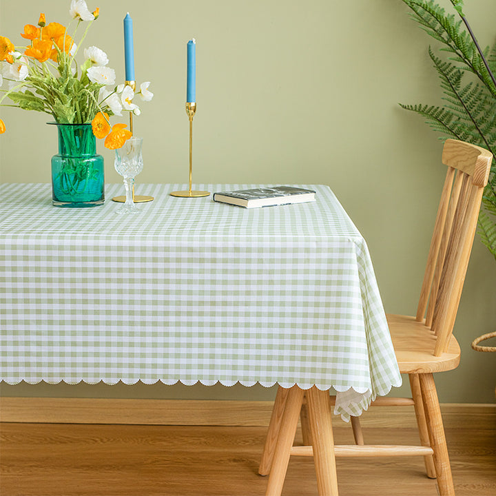 Round washable tablecloth with fine checkered grid pattern and wavy hem