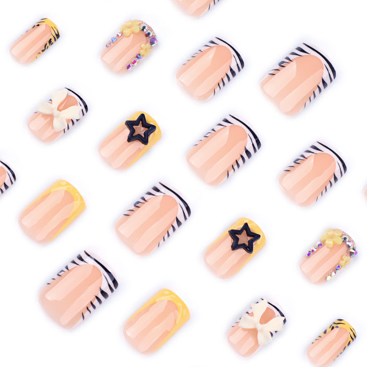 Artistic Nail Art with Glitter and Floral Accents Kalsten