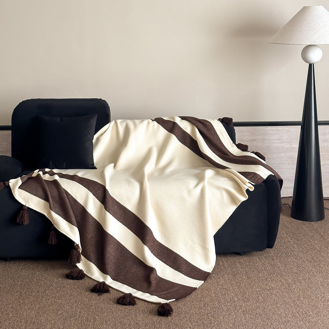 Soft woven blanket with tassels and diagonal stripes