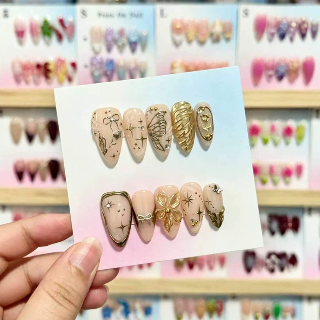 Artistic Press-On Nails Set with Gold and Floral Embellishments