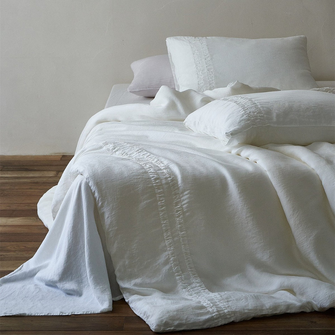 Linen bedding set with stonewash finish and delicate ruffle inserts