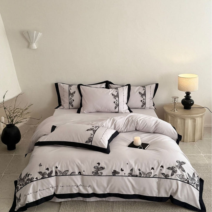 Bedding set with butterfly embroidery and contrast piping