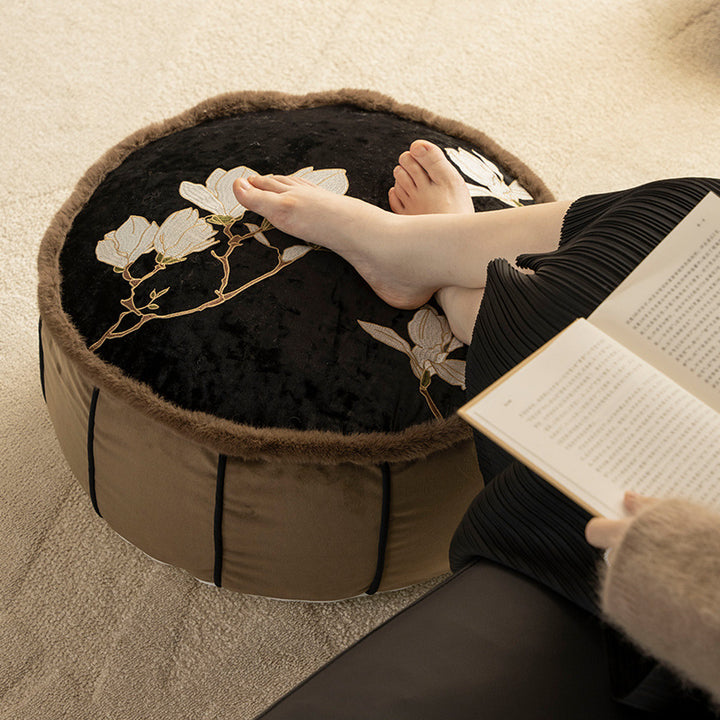 Seat pouf made of embroidered velvet with faux fur trim