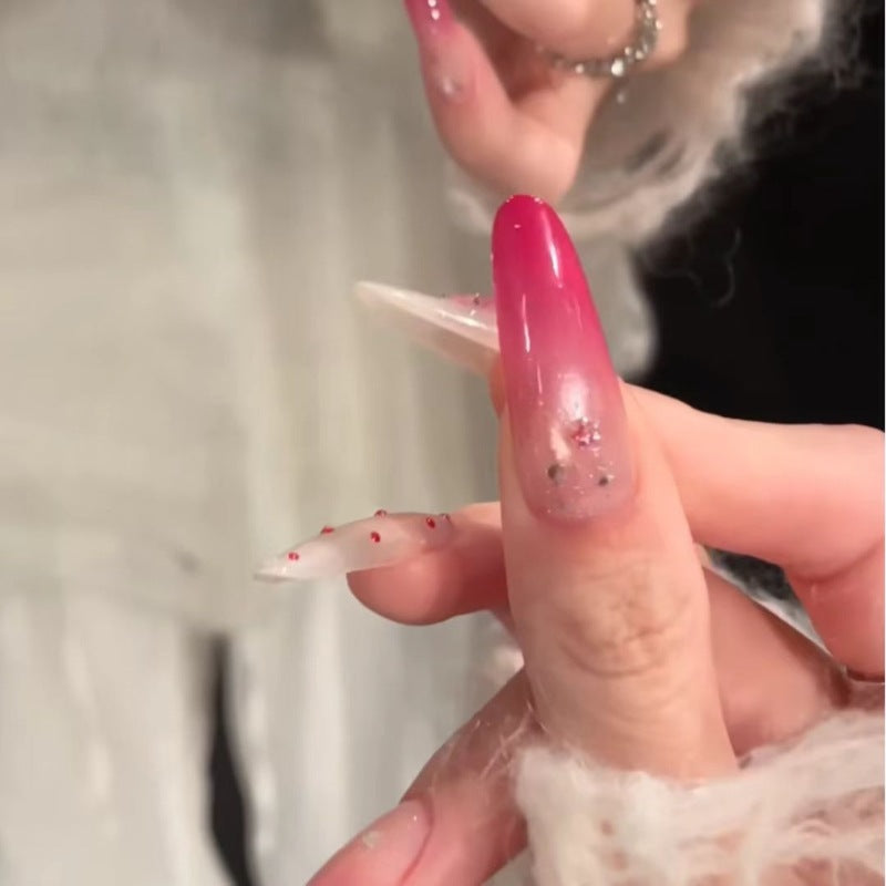 Artistic Gradient Nail Extensions with Decorative Accents