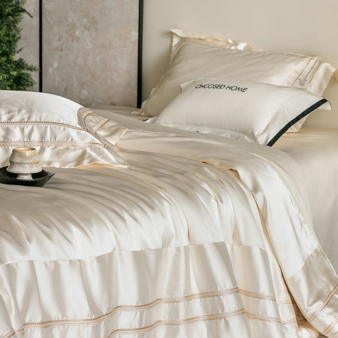 Luxurious satin bedding set with decorative borders and silky-smooth feel