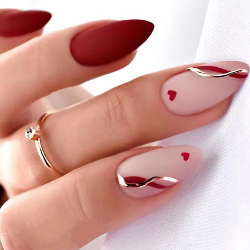 Artful and elegant artificial nails with heart decorations Kalsten