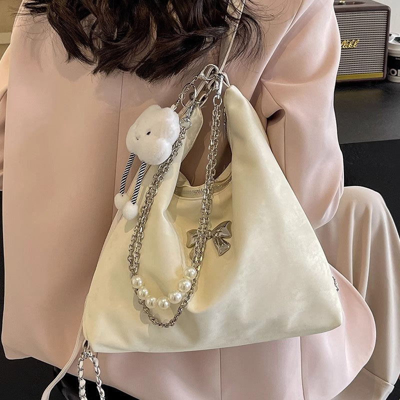Fashionable handbag with unique pendant and chain accents Kalsten