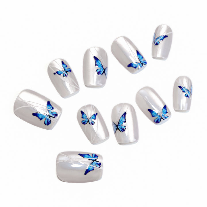 Creative nail extensions with intricate butterfly design Kalsten