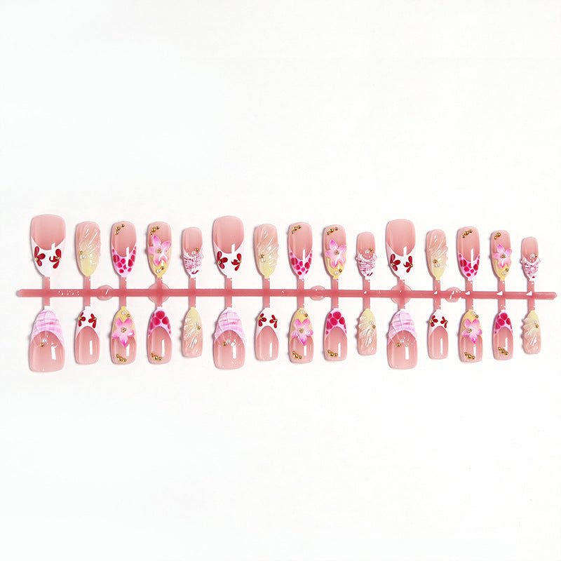 Artificial nails with floral accents and glitter decorations Kalsten
