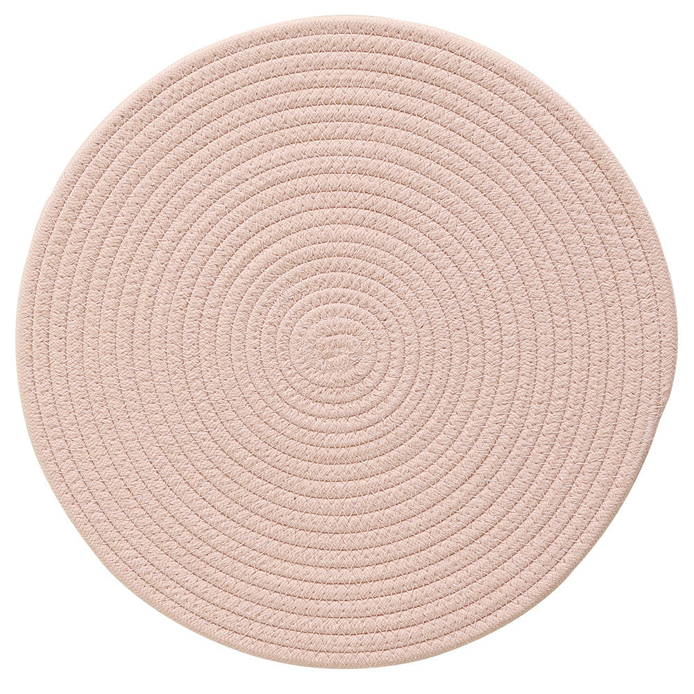 Round woven placemats made of cotton and jute rope with spiral pattern