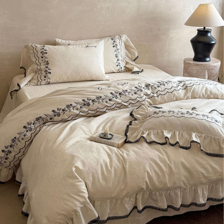 Bedding set with embroidered ruffles and linen look