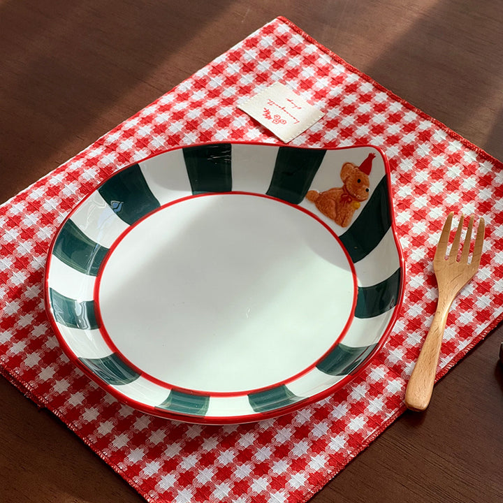 Decorative ceramic deep plate with pouring spout, striped rim and bear motif