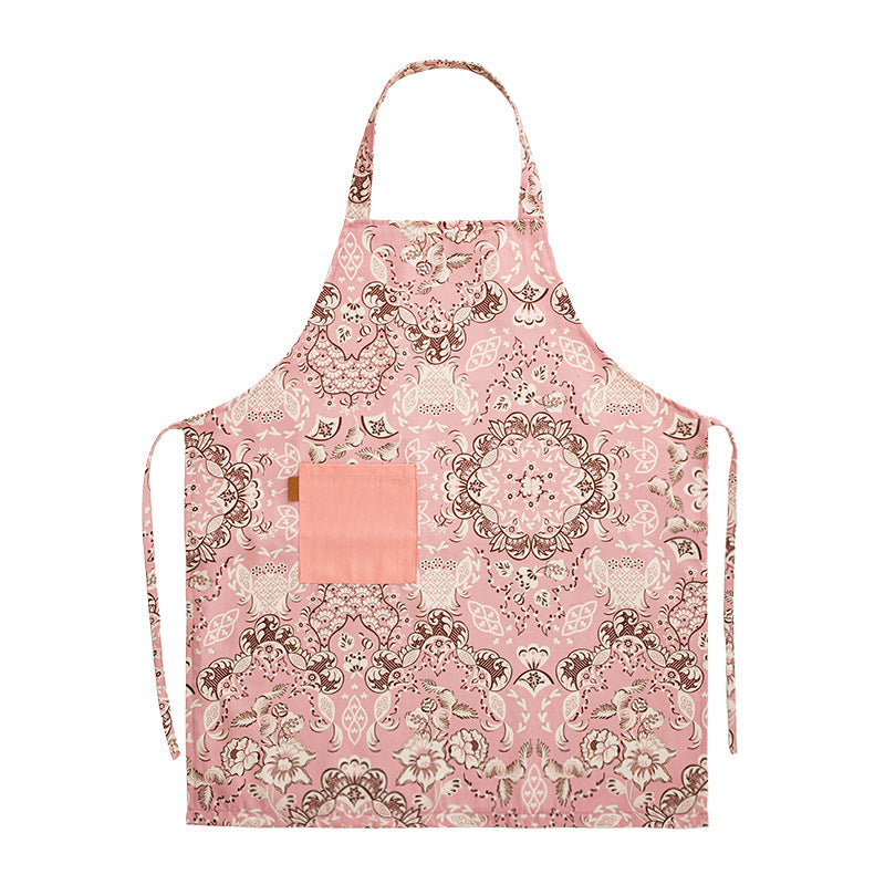 Cotton apron with floral pattern, adjustable neck strap and front pocket
