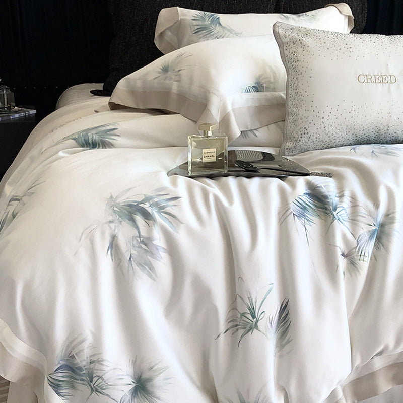 Luxurious cotton satin bedding set with delicate leaf print, contrasting hem and fine piping