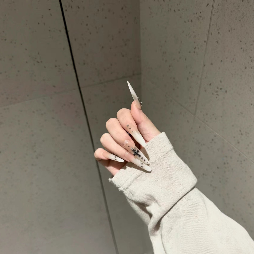 Artistic Stiletto Nail Art Extensions with Decorative Accents